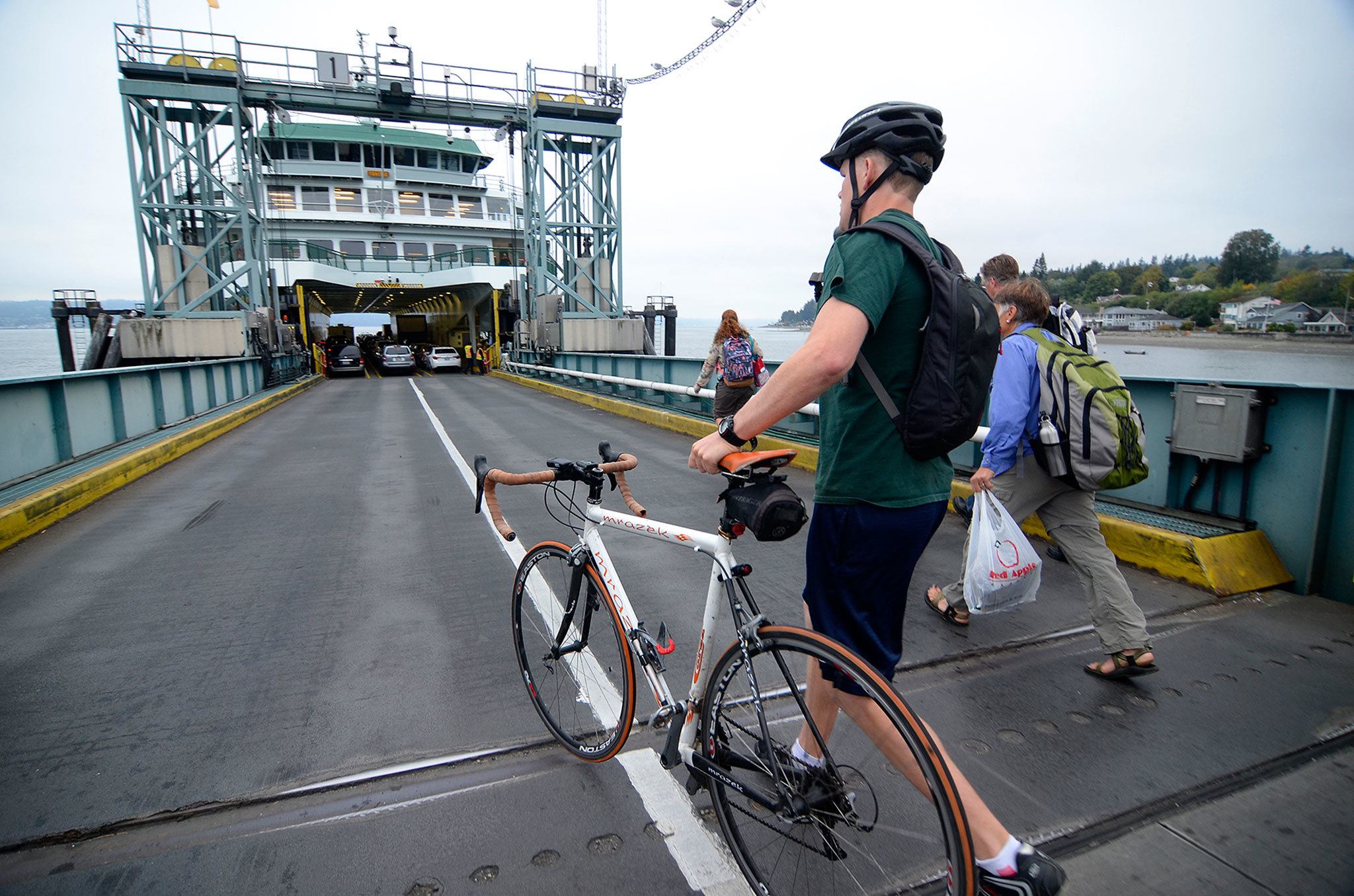 Justin Burnett/Whidbey News Group                                Commuters board the Tokitae in Clinton on Thursday morning. The Clinton Community Council is planning to discuss an effort to lobby for a second 144-car ferry on the route and the addition of overhead loading during a meeting later this month.