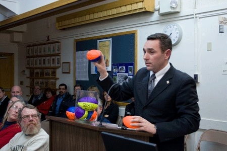 City Engineer Eric Johnston employs the help of seven Nerf footballs and a large jar to visually explain the downtown redevelopment project and the much-discussed one way