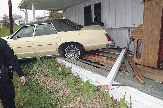 A 1978 Ford wound up rolling on to the back porch of K.C. Pohtilla’s home in Oak Harbor Tuesday. No one was injured.