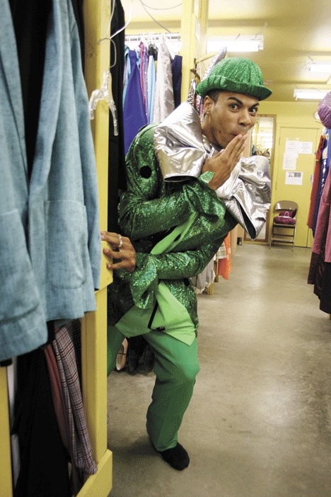 Whidbey Playhouse actor Meiko Parton models an oversized leprechaun suit from the Playhouse Annex.