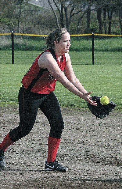 Coupeville's Bessie Walstad flips to first for an out against South Whidbey Monday.