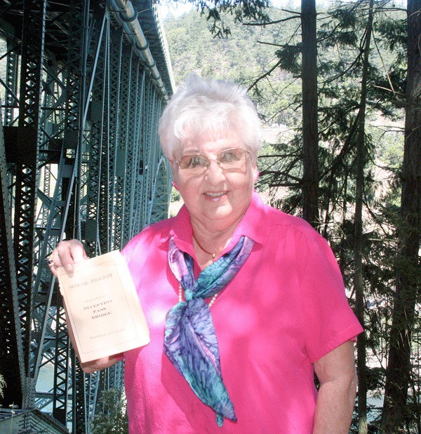 Oak Harbor resident Mary Fuller shows the program of the original Deception Pass Bridge dedication 75 years ago. She was 5 years old when the bridge opened.