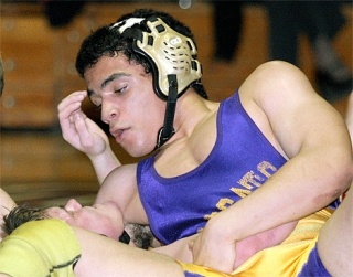 Senior captain John Tuttle won the WesCo North league championship in the 140-pound weight division.