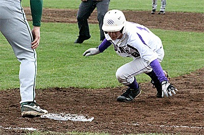 Oak Harbor's Trent Benson scrambles back to first on an attempted pick off.