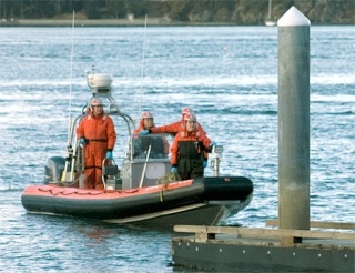 Emergency personnel recovered the body of a woman witnesses said jumped off the Deception Pass Bridge Wednesday afternoon.