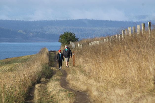Josie and Dave Penrod enter the Ebey's Prairie Ridge Trail from the new Pratt Loop Trail in Coupeville. The ridge trail is essentially part of the new loop trail for those who want to complete a 1.3-mile circle.