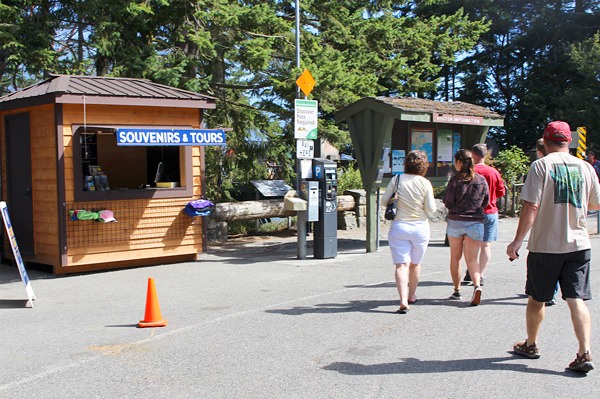 Visitors at Deception Pass State Park walk by a informational kiosk run by the Deception Pass Park Foundation and Deception Pass Tours. The Oak Harbor Chamber’s WOW Wagon is no longer at the park