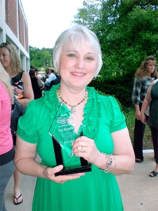 Former Oak Harbor High School cheer coach Pam Headridge received the Pinnacle Award for coaching excellence.