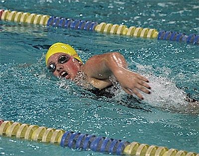 Sophie Dickinson cuts eight seconds off her previous best in the 400-meter freestyle.