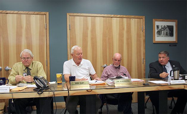 Members of the Island Transit board discuss financial issues during a special meeting.