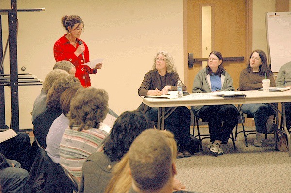 Oak Harbor High School boys swim coach Amy Nurvic addresses the school district budge committee about the proposed elimination of the swim and golf programs.