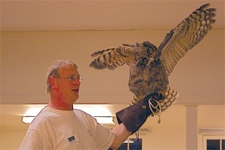 Michael Pratt holds Orion. He spoke to Audobon society members at the Coupeville Recreation Hall about owls of Washington.