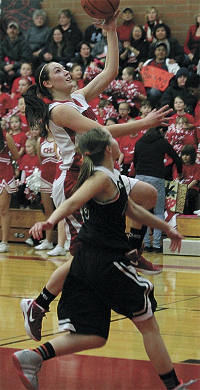 Amanda Fabrizi flies by a Granite Falls defender to score two of her game-high 20 points.
