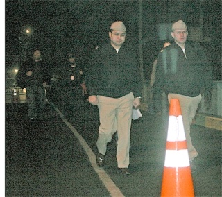 Chief Petty Officer Manuel Vidaurri and Chief Petty Officer Kevin Dolan walk from the  Keystone ferry terminal to head to Whidbey Island Naval Air Station.