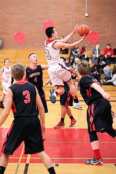 C.J. Smith splits the Port Townsend defense for two of his 11 points.