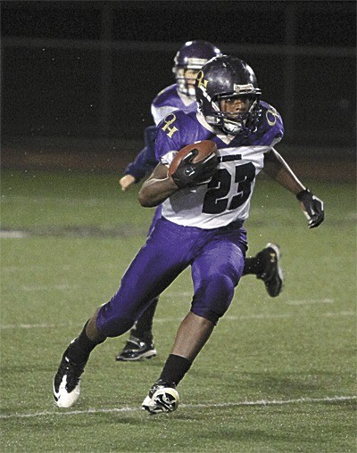 Princeton Lollar of the Oak Harbor Jaguars looks for running room during the championship game with Ferndale.