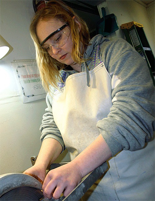 Mary Carlson works on a rock creation in the Gem Club’s shop next to the Oak Harbor Senior Center.