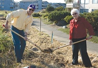Sen. Mary Margaret Haugen and City Council member Rick Almberg break ground for the coonective section of the waterfront trail at Flintstone Park on a pleasant Monday afternoon.