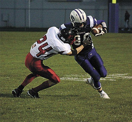 Coupeville's Matt Hampton tackles Nooksack Valley's Brady Wood.