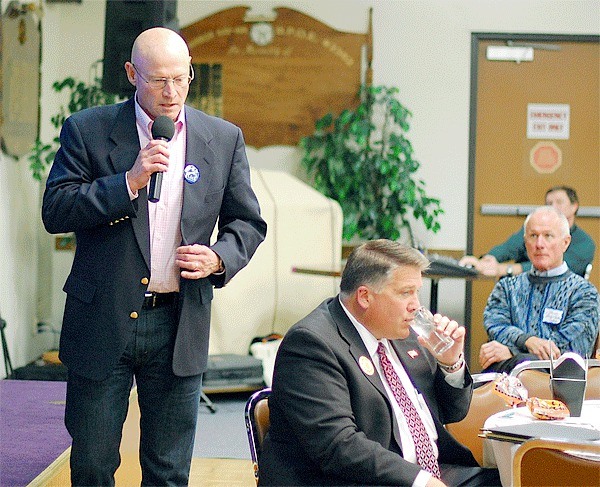 Oak Harbor City Council candidate Rick Almberg speaks during the Oak Harbor Chamber of Commerce’s political forum Thursday. Sitting at right is mayoral candidate Scott Dudley.