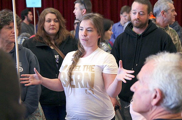 Shannon Olson sports a ‘Feel the Bern’ shirt as she advocates for Bernie Sanders during the Democratic caucus in Oak Harbor Saturday.