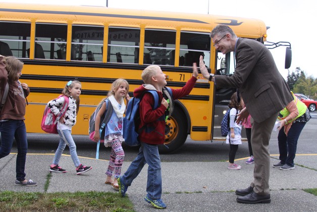 Oak Harbor Public Schools Superintendent Lance Gibbon greets students at Hillcrest Elementary Tuesday morning