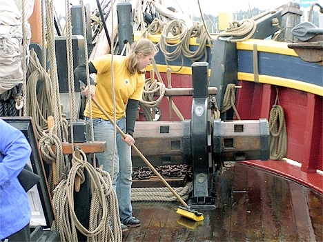 Kelly Snoden of Coupeville swabs the deck of the Lady Washington