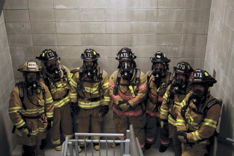 Navy Region Northwest firefighters train in full gear for the Scott Firefighter Stairclimb