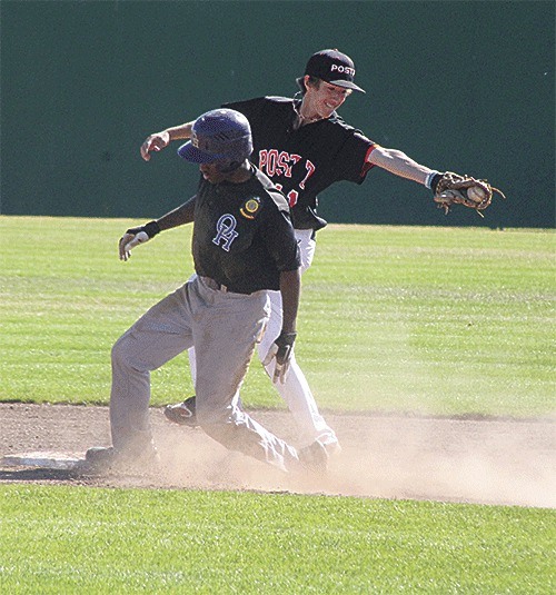 Oak Harbor's Anthony Stewart steals second in Friday's loss to Bellingham as Post 7 second baseman Alexander Richard snares the wide throw.