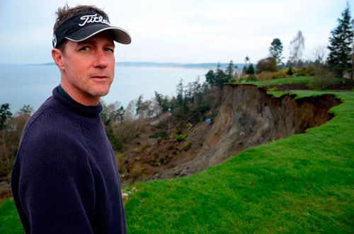Bret Holmes describes waking up this morning to the sound of a massive landslide that devastated Ledgewood at about 4 a.m. Holmes has lost more than 30 feet of his yard and his house is now under threat as the bluff is still sloughing off.