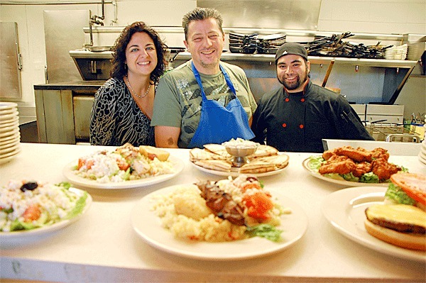 Zorba’s Greek and Italian Restaurant owners Helen and Chris Pantoleon pose for picture with head chef George Pardington in the kitchen of their new digs off Highway 20