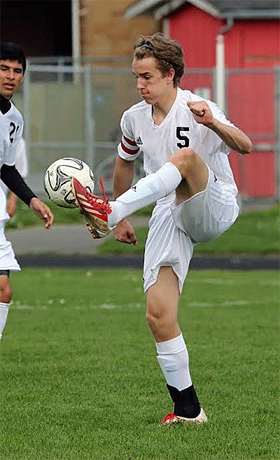 Joel Walstad controls the ball for Coupeville in Saturday's match. He also shutout Forks as the Wolves' goal keeper in the first half.