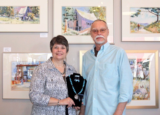 Joanne Deckwa holds some of her jewelry with Randy Emmons