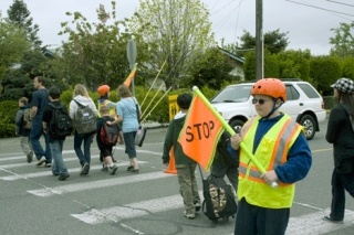 Christian Schnacker leads a group of students safely across the street. The Broad View 5th grader was named to the state’s School Safety Patrol Hall of Fame.
