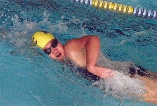 Kennedy Trisler strokes her way to a third-place finish in the 11-to-12-year-old girls 50-meter freestyle.