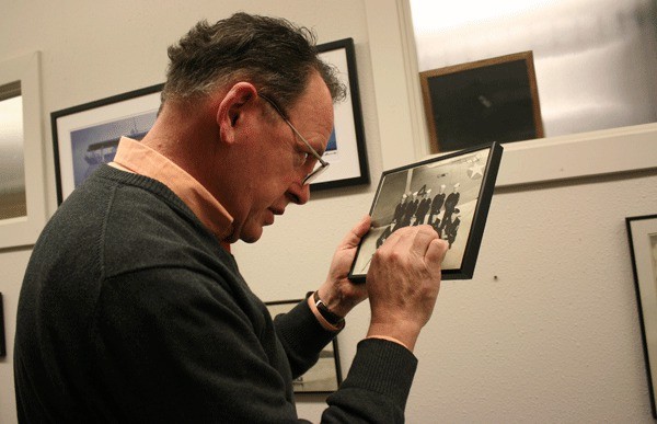 Memorial director William Stein identifies an enlisted pilot from a World War II era photo.
