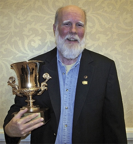 Clifton View Homes owner Ted Clifton holds his Builder of the Year award. The Coupeville builder received the award from the Building Industry Association of Washington.