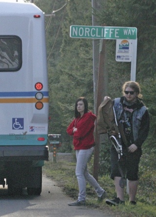 Kyle Gonzales and Jessica Staley get off a bus at a stop in rural North Whidbey. They are in favor of a bill that would clarify state law to allow buses to stop at unmarked places in rural areas. Gonzales said he ended up walking six miles in the countryside outside Burlington because the bus wouldn’t stop where he asked.