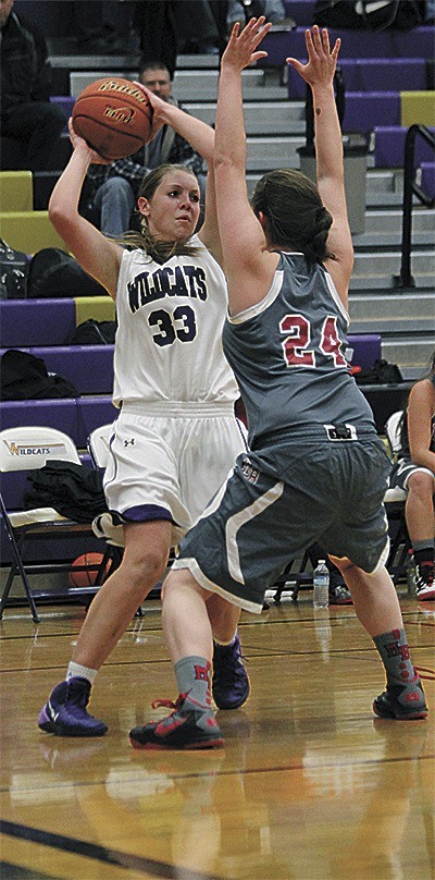 Oak Harbor's Hayley Lundstrom looks to pass around the defense of Mount Baker's Emily Yost.