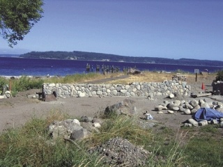 Greenbank resident Bruce Montgomery put up a wall to prevent people from driving over his septic system or visiting the beach. He says the beach is his private property