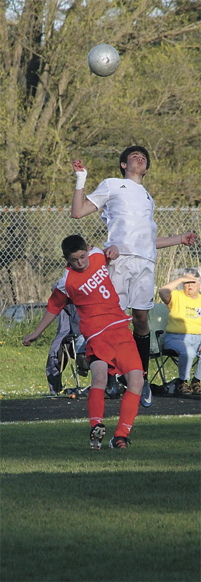 Coupeville's Nathan Kircher flies above Granite Falls' Conor White in the Wolves' 4-1 win Wednesday.
