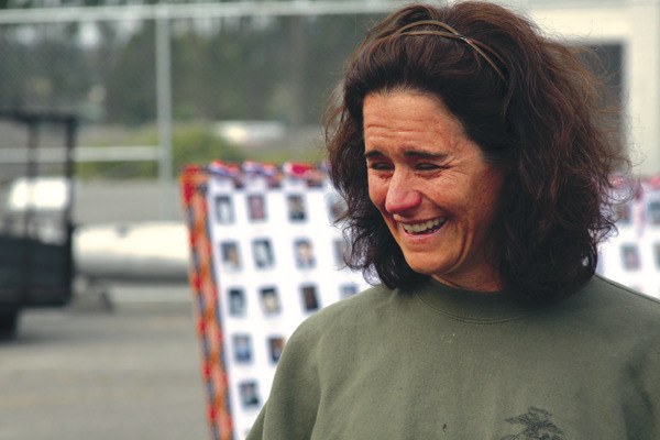 Bridget Guerrero tries to fight back tears Thursday in Oak Harbor as she talks about Megan McClung before embarking on a 160-mile run to honor fallen female servicewomen since 9/11.