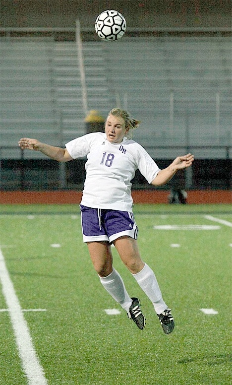 Wildcat Millie Goebel (18) clears the ball with a header against Lake Stevens Thursday.