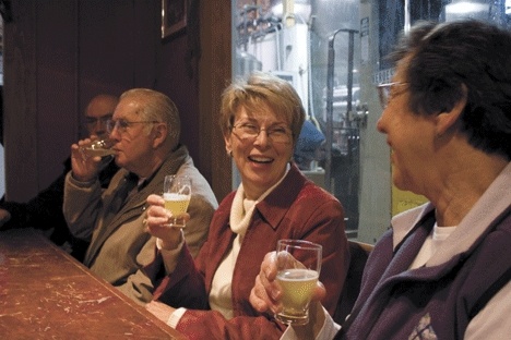 Mary Mauth shares a laugh with her fellow day-trip travelers at their first stop