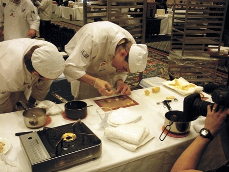 Luke Felkner and Tyler Johnson feel the pressure of the camera while cooking in the National ProStart competition held in April in San Diego.