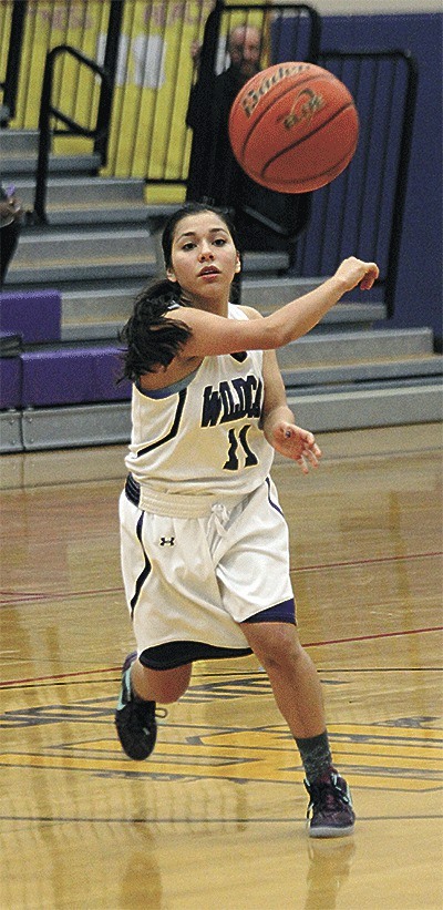 Natalie Fiallos tosses a pass in the Wildcats' narrow loss Friday. Fiallos scored nine points in the third quarter to help the Wildcats get back into the game.