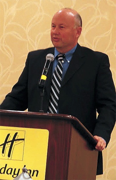 Dave Ward gives his acceptance speech during his induction into the state football coaches Hall of Fame.