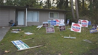 Political signs litter the front yard of an Oak Harbor home - a likely post-election prank. Campaign signs must be removed by Nov. 14.