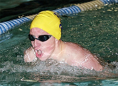 Oak Harbor's Jared Hunt swims to third place in the 100-meter breaststroke Monday.