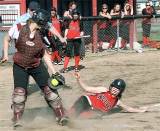 Katie Smith slides safely across the plate in the second inning with Coupeville’s first run of the game. Smith scored on an infield out by Taylor Sherman.